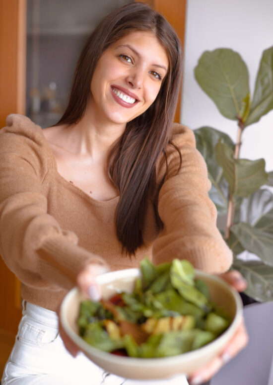 Ana Rebelo, author of zestandthecity.com with a salad bowl